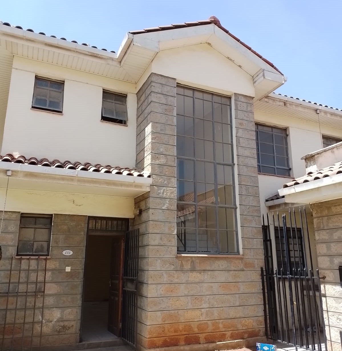 The property is situated in a secure gated community with easy access to major social amenities. It is located close to Signature Mall, Total petrol station, St. Bhakita School and numerous other nearby shopping centers. Accommodation details entail: entry porch; spacious living room; dining area; kitchen fitted with single drain sink unit, granite worktop, below and overhead cabinets, pantry; detached DSQ ensuite; cloakroom; 2 No. bedrooms fitted with built-in wardrobes; master bedroom ensuite; etc. The property also has a private garden, roads within the development are cabbro paved, borehole water supply and alternative power supply. Get in touch for viewing and or booking.             
Additional features include smooth and easy access to the Mlolongo Expressway toll station.